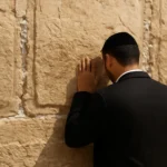 prayer at the western wall in jerusalem